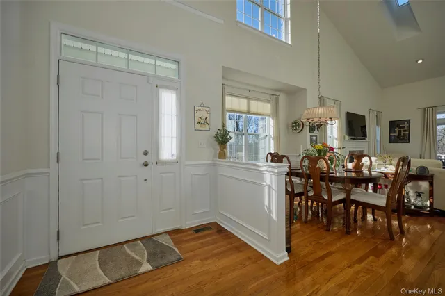 a view of a livingroom with furniture and hardwood floor