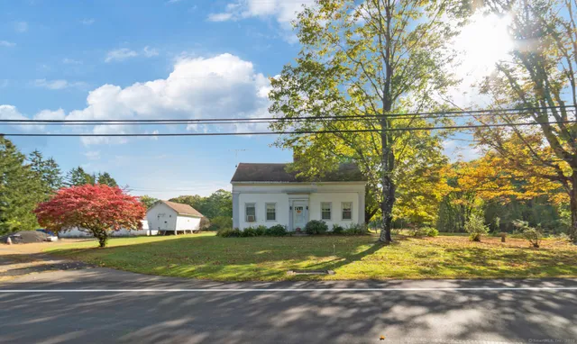 a view of a house with a yard