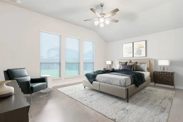 a spacious bedroom with a bed and glass window
