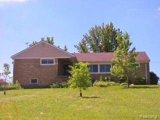 871 Academy Road Holly, MI 48442 - Photo 1 of 17 academy summer front.jpg