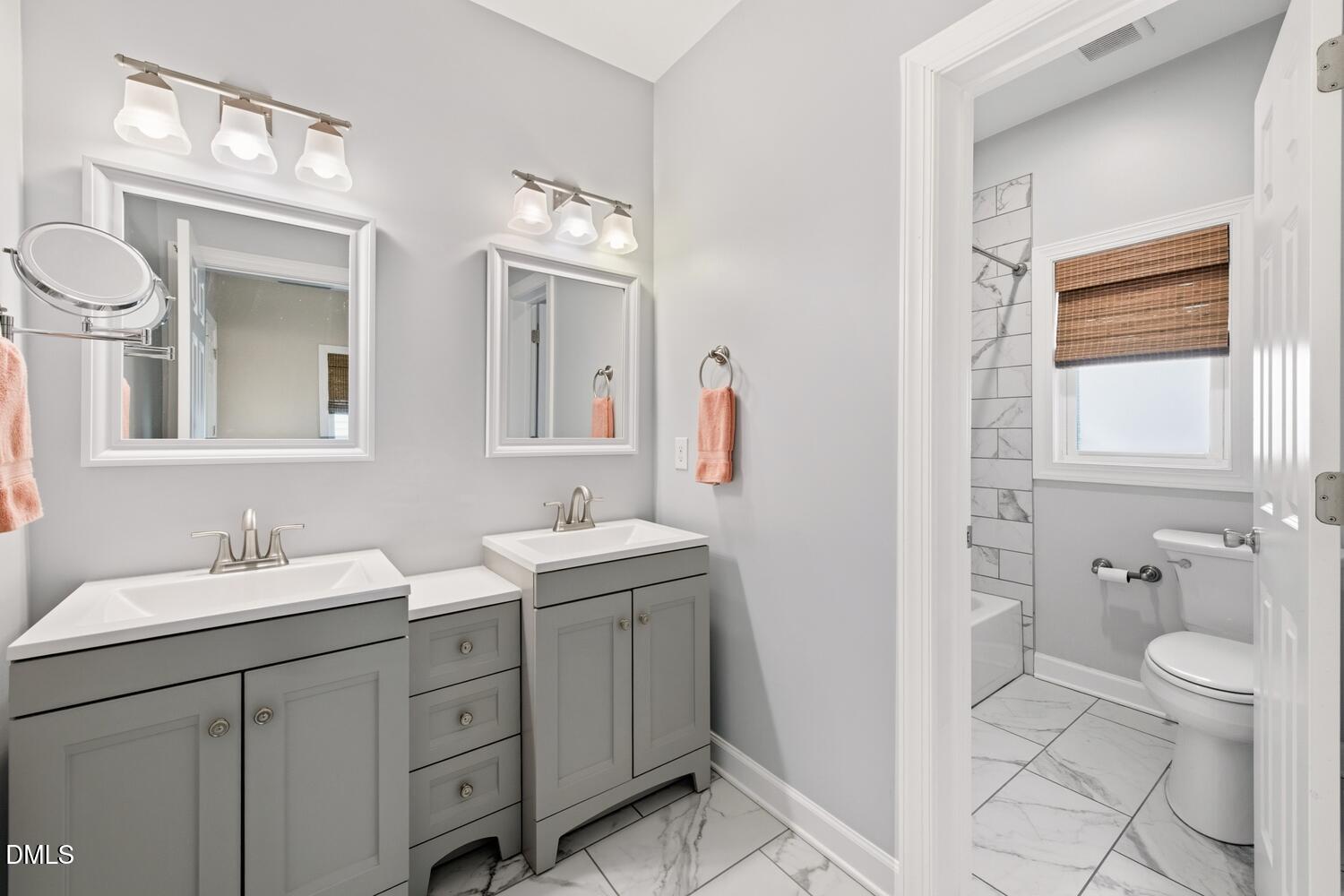 217 Moline Street Durham, NC 27707 - Photo 9 of 30 a bathroom with a toilet a sink a and mirror