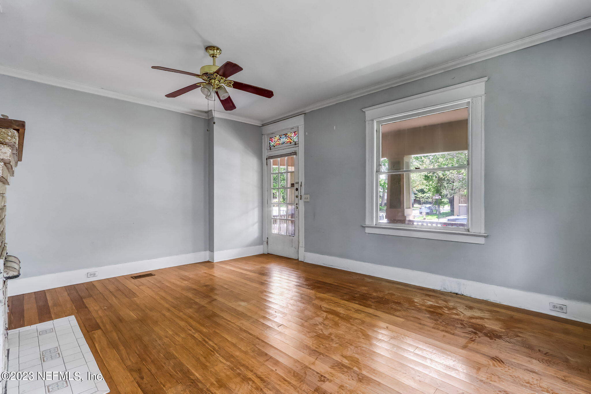 2805 College Street Jacksonville, FL 32205 - Photo 11 of 40 a view of an empty room with window and wooden floor