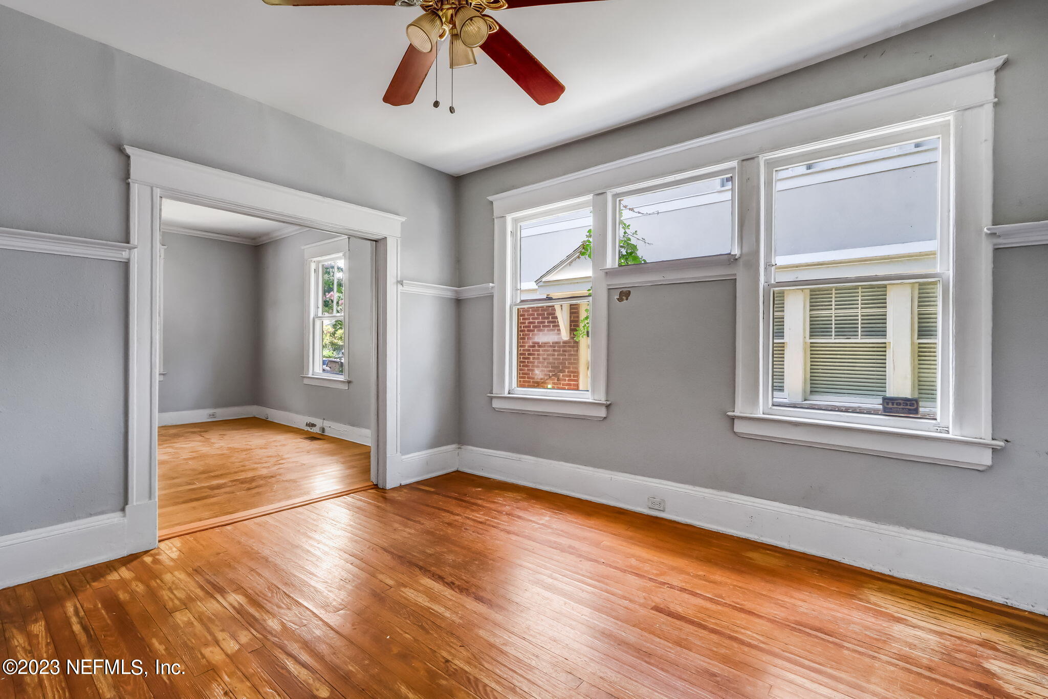 2805 College Street Jacksonville, FL 32205 - Photo 14 of 40 a view of empty room with wooden floor and fan