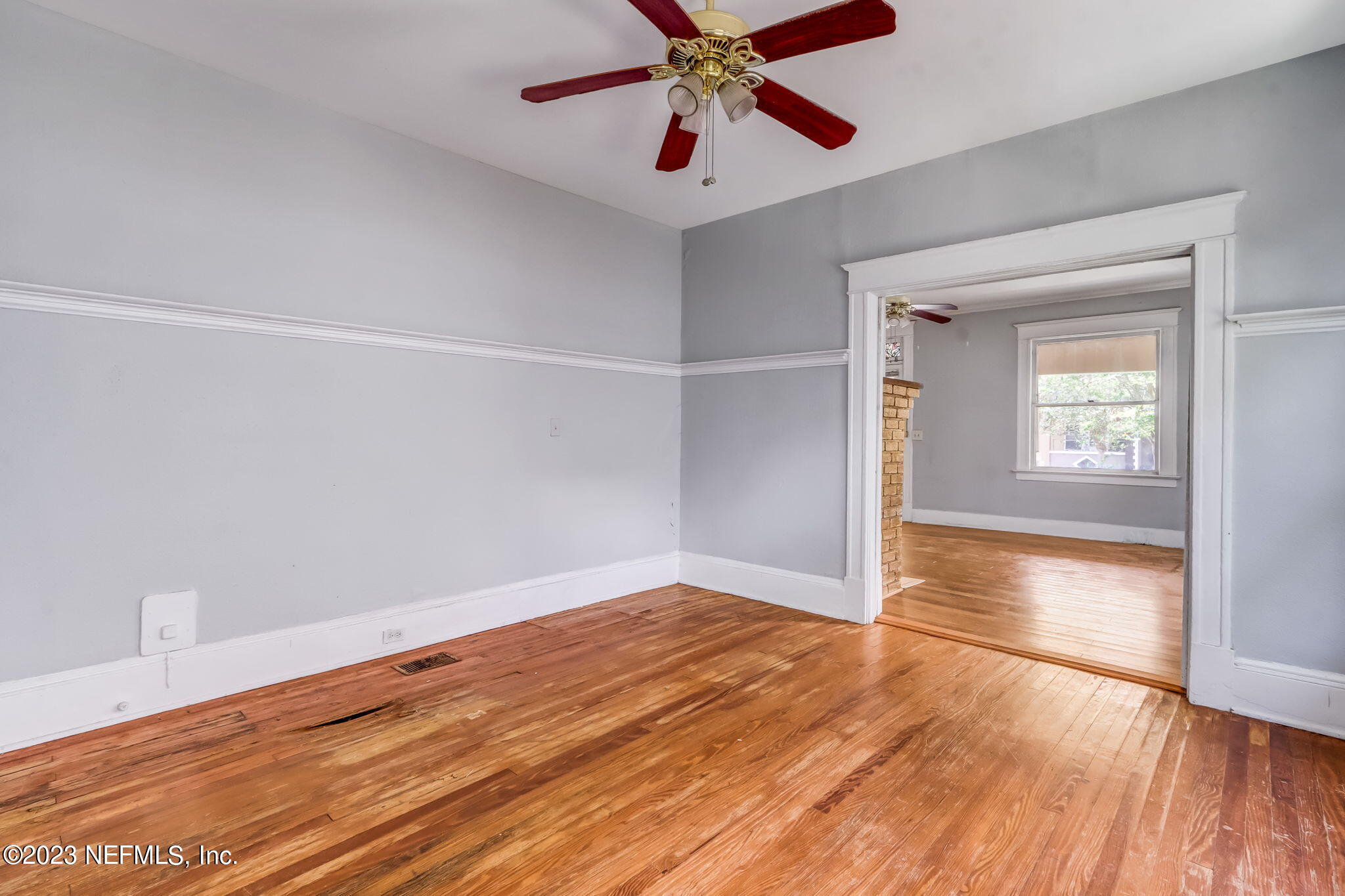 2805 College Street Jacksonville, FL 32205 - Photo 15 of 40 a view of an empty room with wooden floor and a window