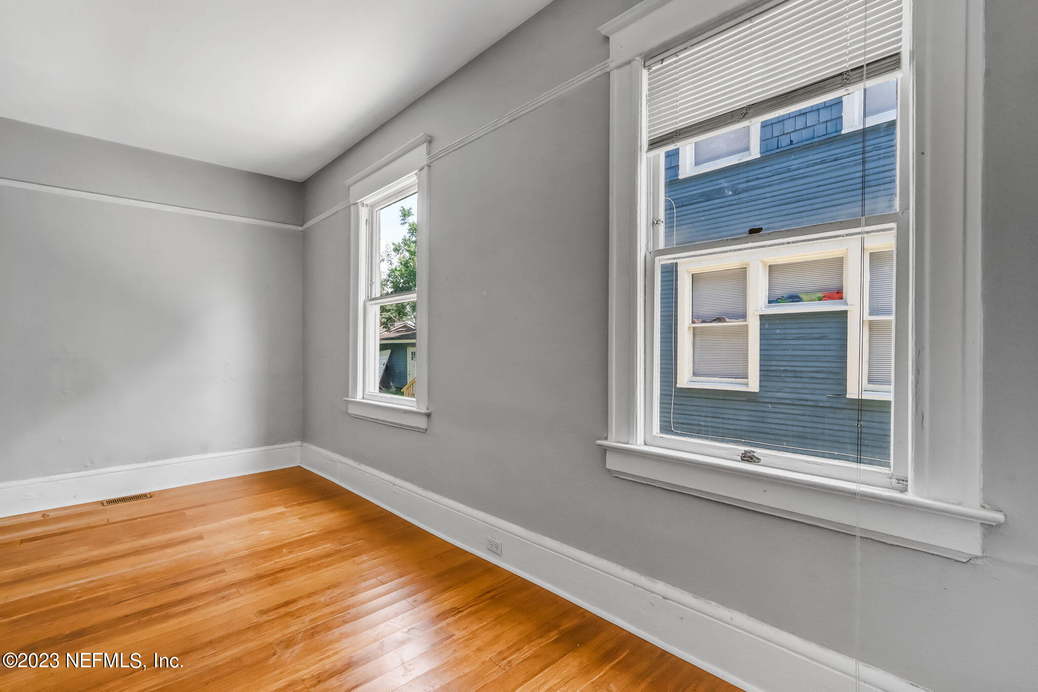2805 College Street Jacksonville, FL 32205 - Photo 18 of 40 a view of an empty room with wooden floor and a window