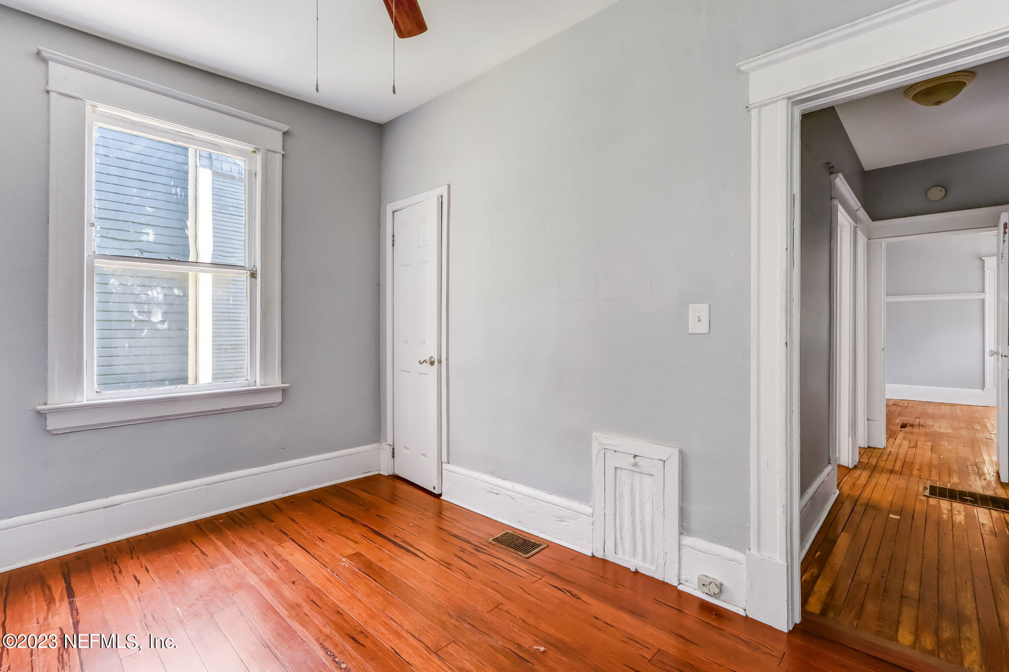 2805 College Street Jacksonville, FL 32205 - Photo 21 of 40 a view of empty room with wooden floor and fan