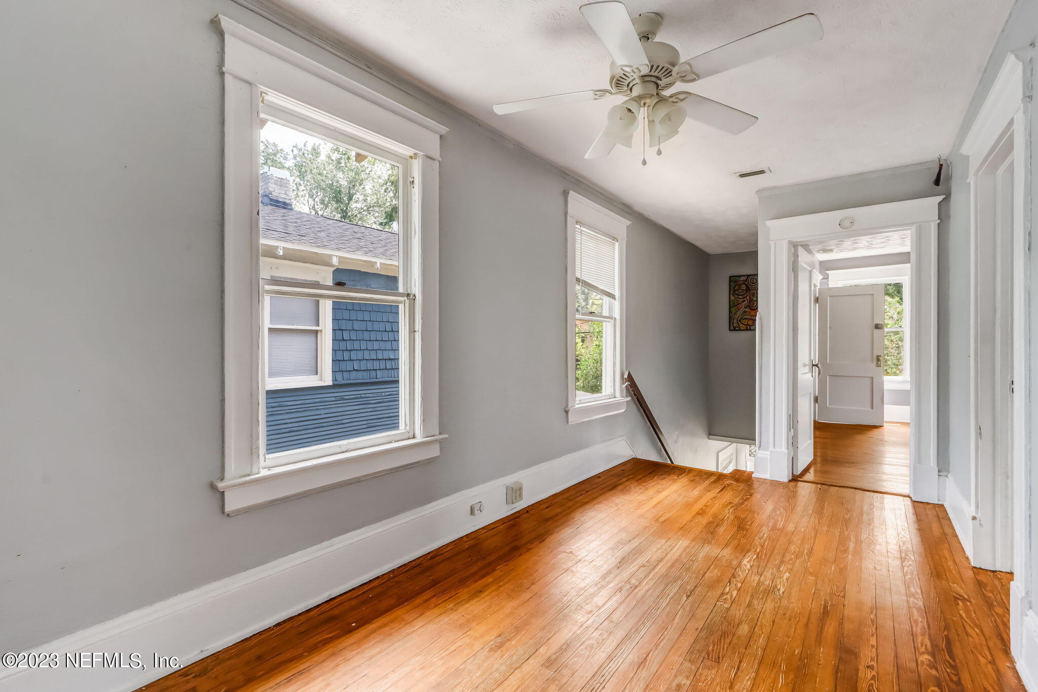 2805 College Street Jacksonville, FL 32205 - Photo 25 of 40 a view of an empty room with window and wooden floor