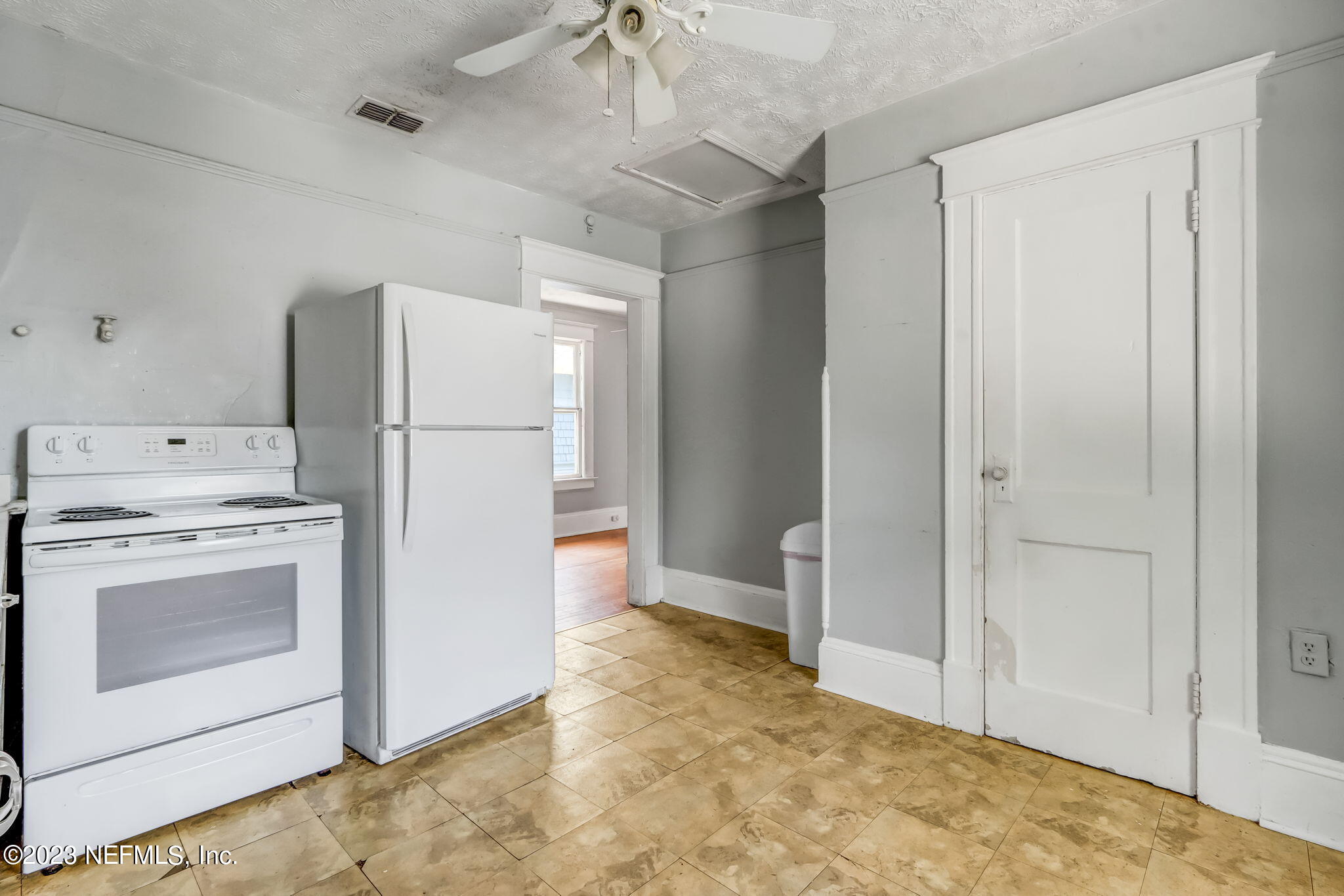 2805 College Street Jacksonville, FL 32205 - Photo 30 of 40 a kitchen with a refrigerator sink stove and cabinets