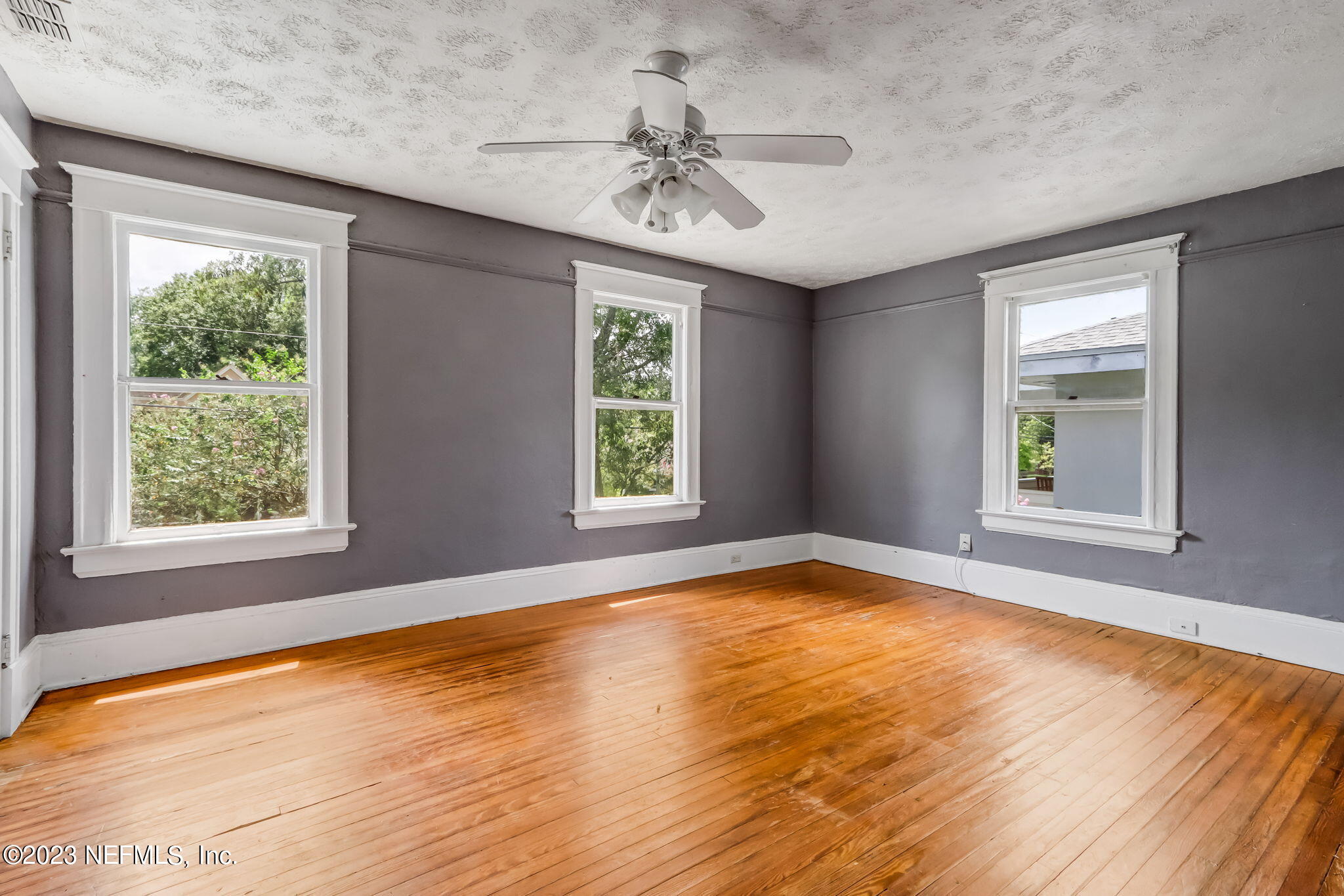 2805 College Street Jacksonville, FL 32205 - Photo 36 of 40 a view of an empty room with a window and wooden floor