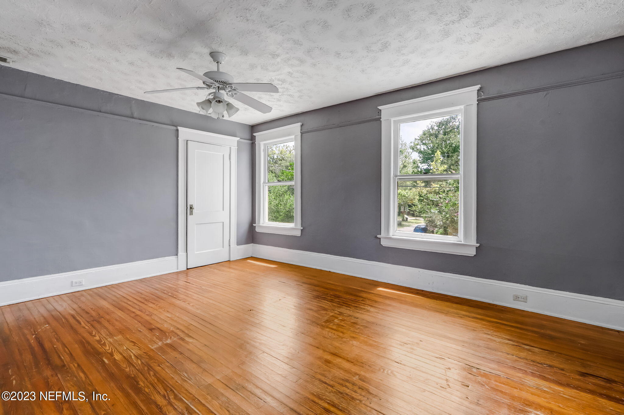 2805 College Street Jacksonville, FL 32205 - Photo 37 of 40 a view of an empty room with a window and wooden floor
