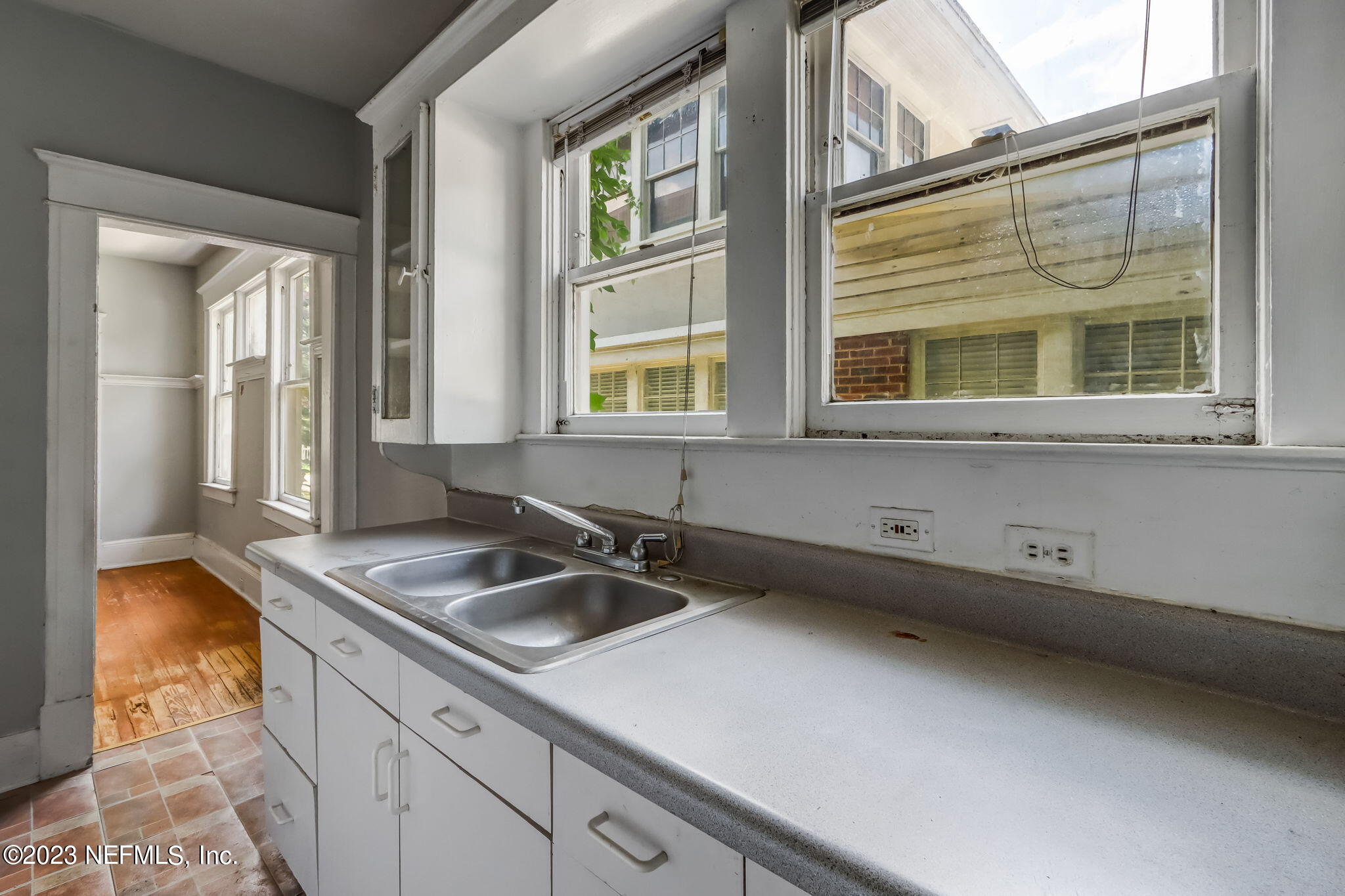 2805 College Street Jacksonville, FL 32205 - Photo 7 of 40 a kitchen with a sink and a window