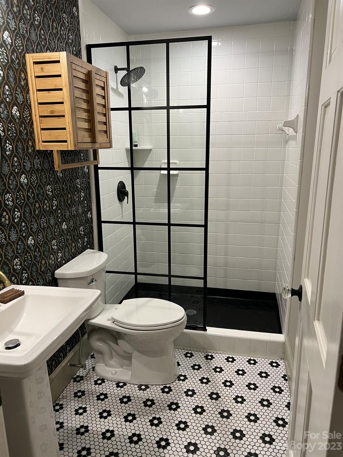 4101 Coleman Drive Charlotte, NC 28215 - Photo 23 of 34 a bathroom with a sink a toilet and shower