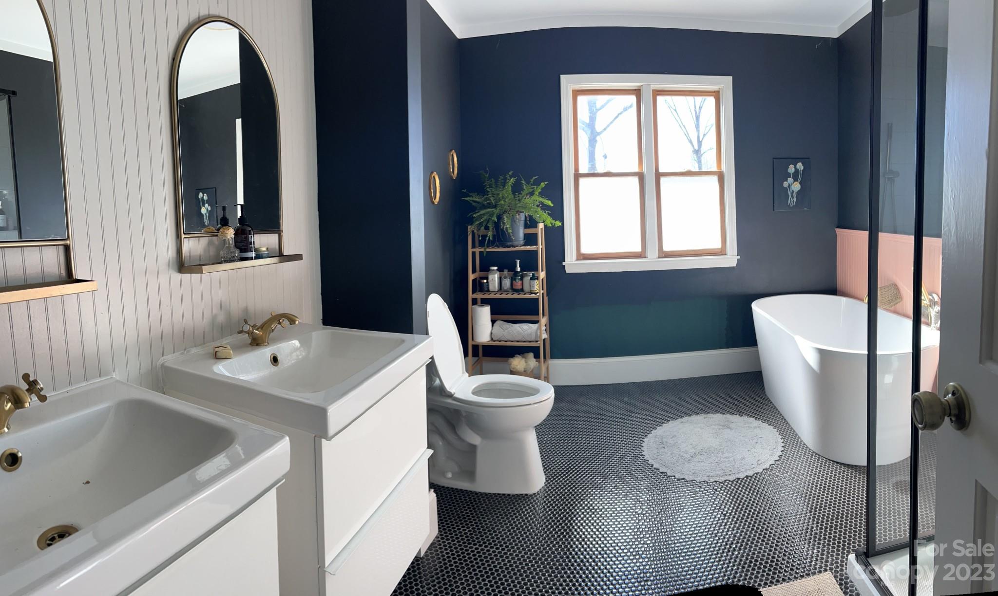 4101 Coleman Drive Charlotte, NC 28215 - Photo 30 of 34 a bathroom with a toilet sink and mirror