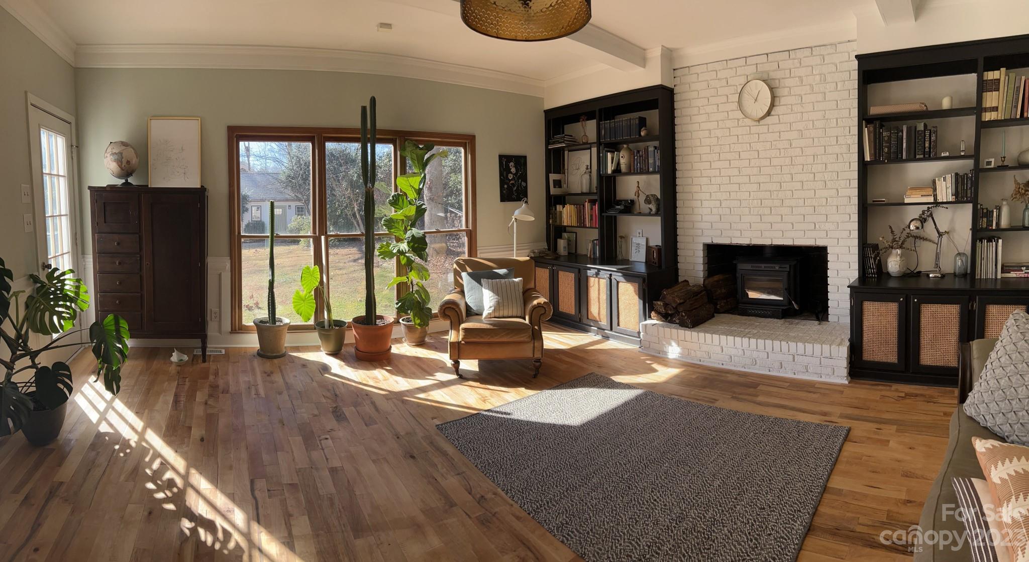 4101 Coleman Drive Charlotte, NC 28215 - Photo 5 of 34 a living room with fireplace furniture and a floor to ceiling window