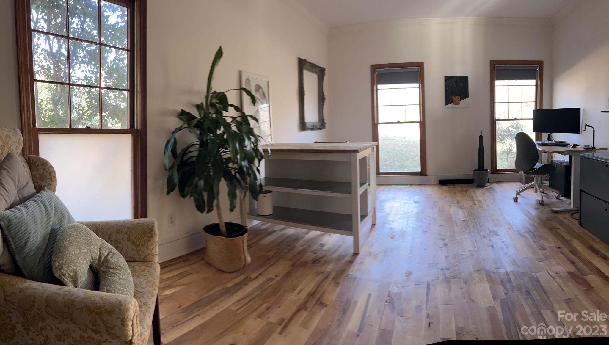 4101 Coleman Drive Charlotte, NC 28215 - Photo 7 of 34 a living room with furniture and a potted plant
