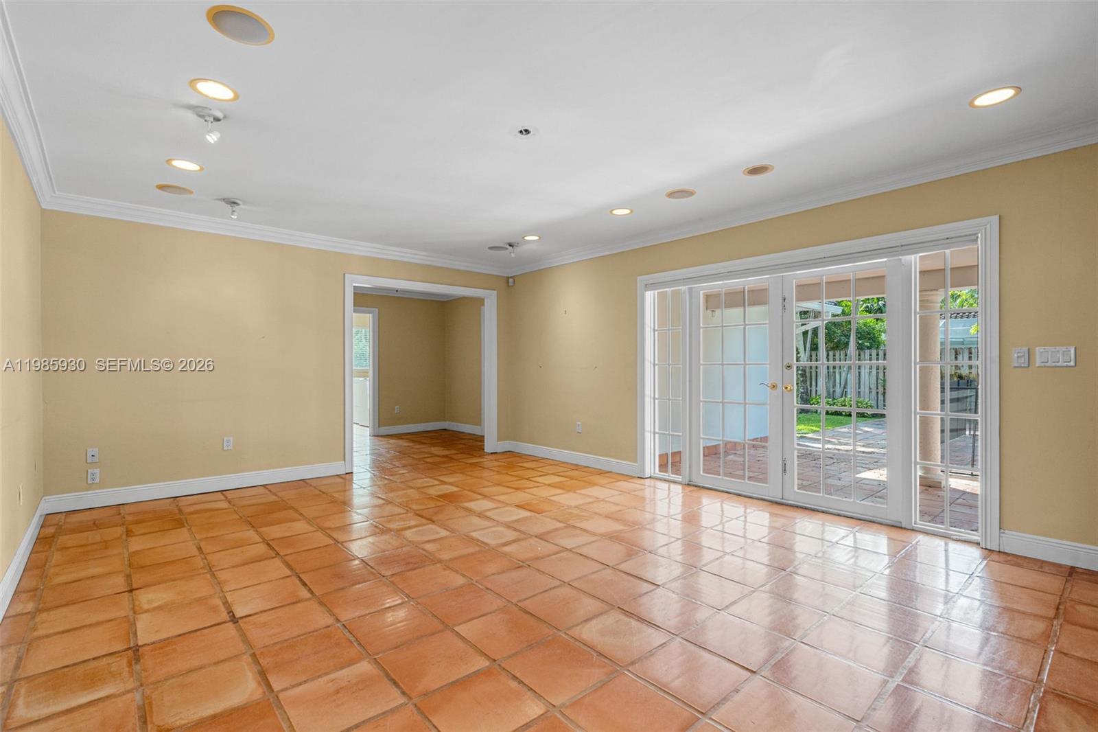 13276 Southwest 58th Court Pinecrest, FL 33156 - Photo 13 of 67 a view of an empty room with wooden floor and a window