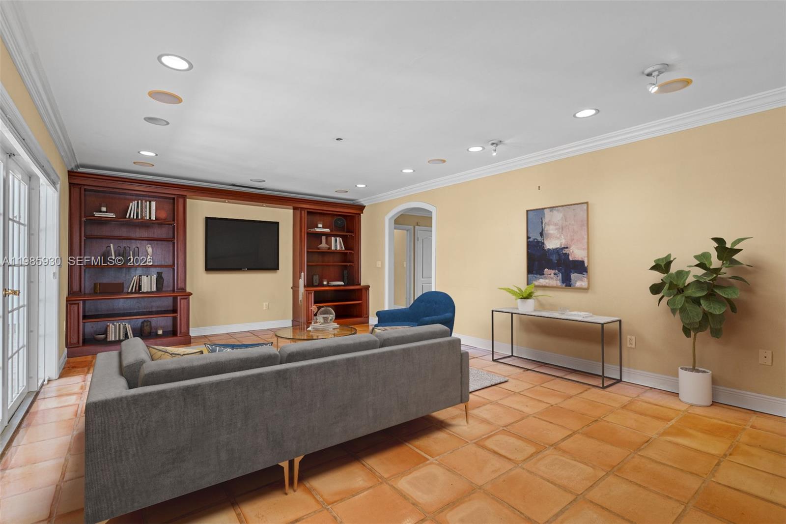 13276 Southwest 58th Court Pinecrest, FL 33156 - Photo 15 of 67 a living room with furniture and a flat screen tv