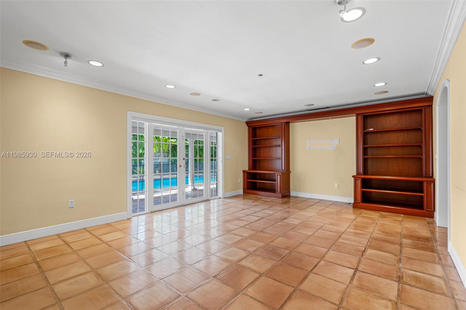 13276 Southwest 58th Court Pinecrest, FL 33156 - Photo 17 of 67 a view of an empty room with a window