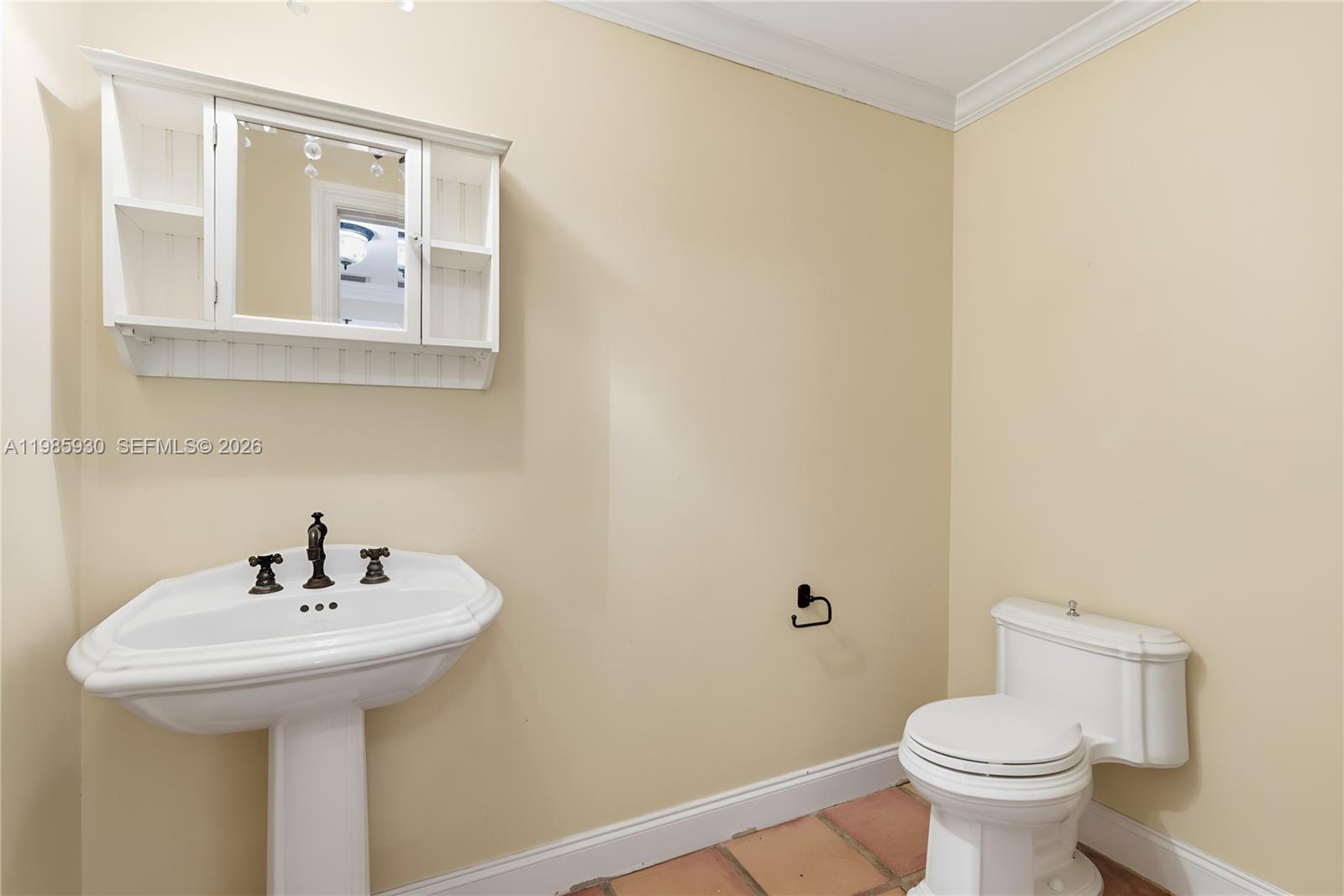 13276 Southwest 58th Court Pinecrest, FL 33156 - Photo 20 of 67 a bathroom with a sink and mirror