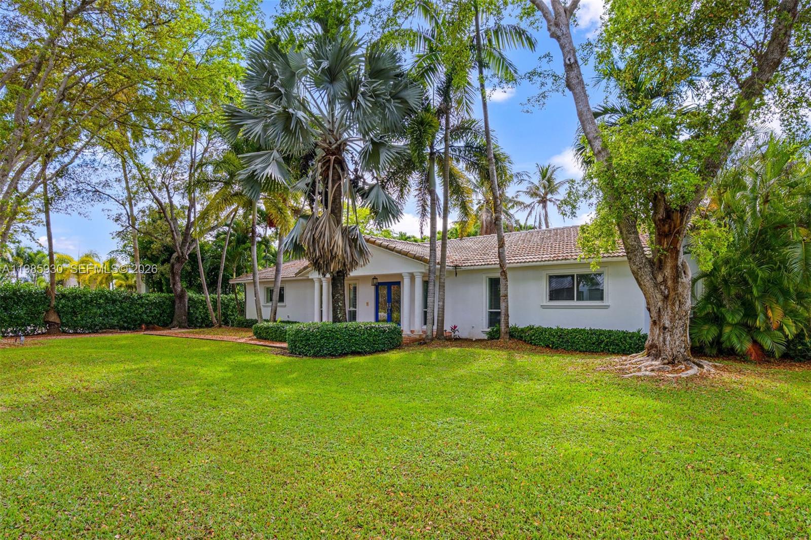 13276 Southwest 58th Court Pinecrest, FL 33156 - Photo 2 of 67 front view of a house with a yard