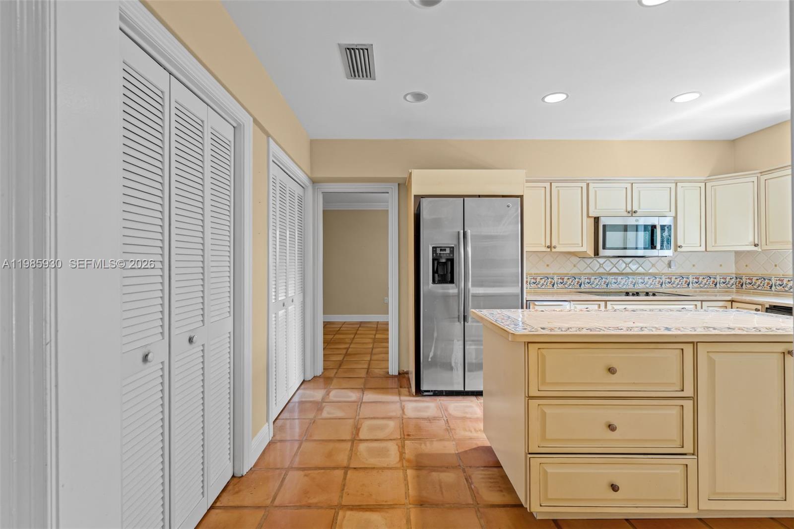 13276 Southwest 58th Court Pinecrest, FL 33156 - Photo 21 of 67 a bathroom with a granite countertop sink and a mirror