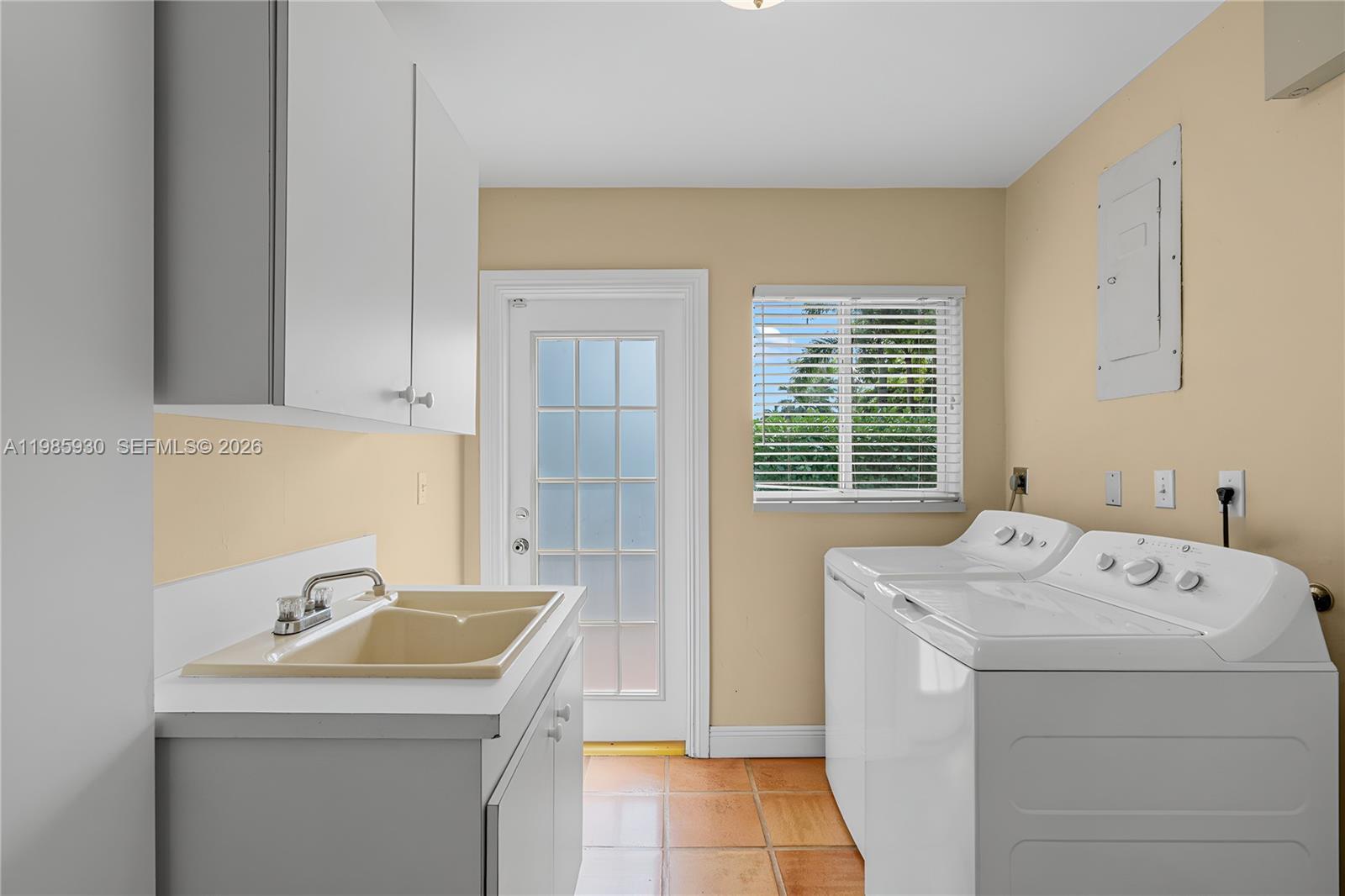 13276 Southwest 58th Court Pinecrest, FL 33156 - Photo 26 of 67 a utility room with dryer and washer