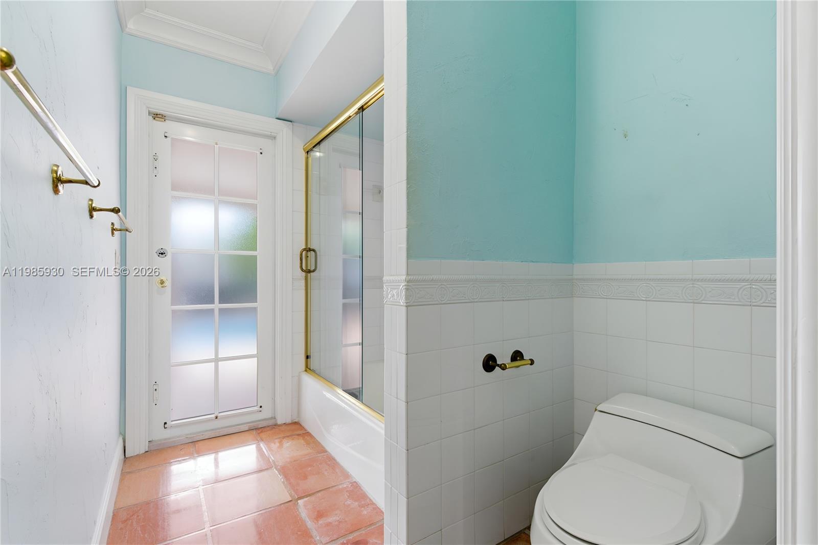 13276 Southwest 58th Court Pinecrest, FL 33156 - Photo 33 of 67 a bathroom with a toilet and a shower