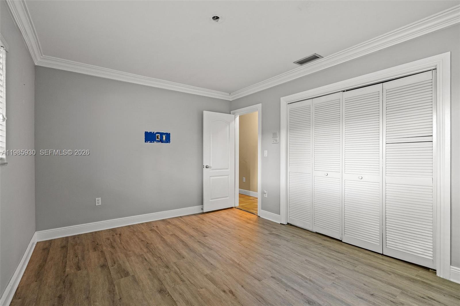 13276 Southwest 58th Court Pinecrest, FL 33156 - Photo 37 of 67 an empty room with wooden floor and closet
