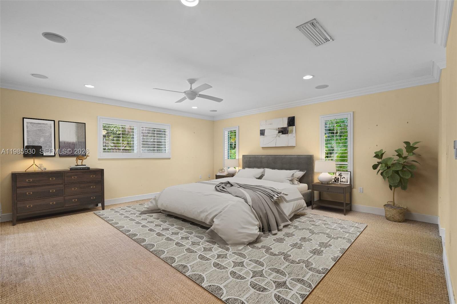 13276 Southwest 58th Court Pinecrest, FL 33156 - Photo 38 of 67 a bedroom with a large bed and a couch