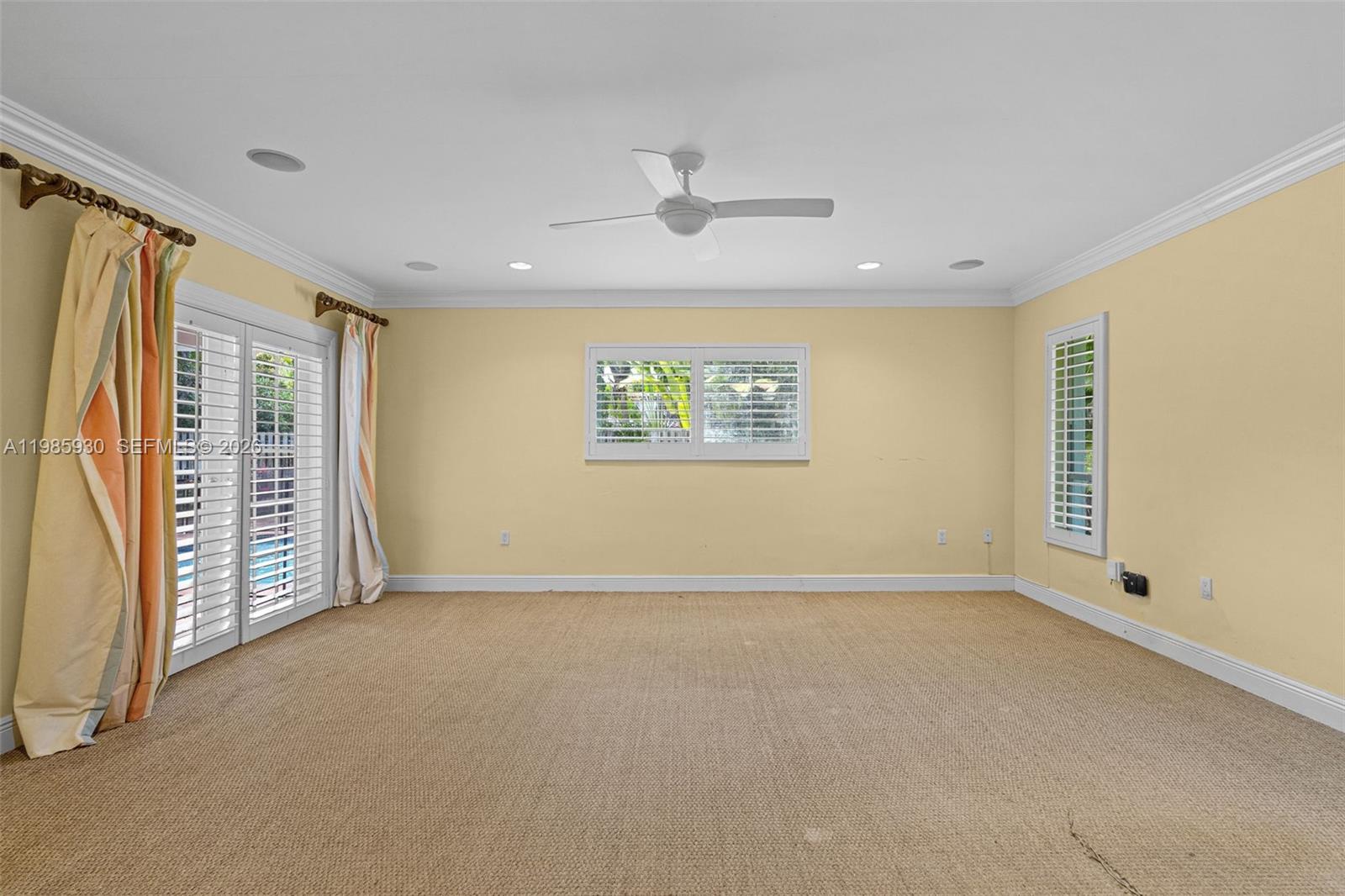 13276 Southwest 58th Court Pinecrest, FL 33156 - Photo 40 of 67 an empty room with windows