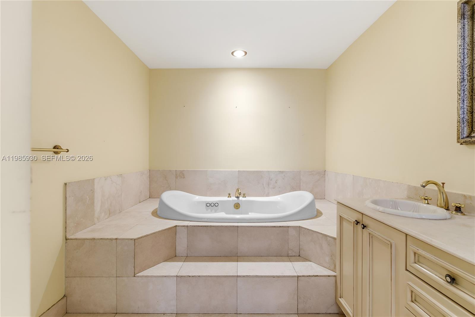 13276 Southwest 58th Court Pinecrest, FL 33156 - Photo 46 of 67 a bathroom with a sink and a mirror