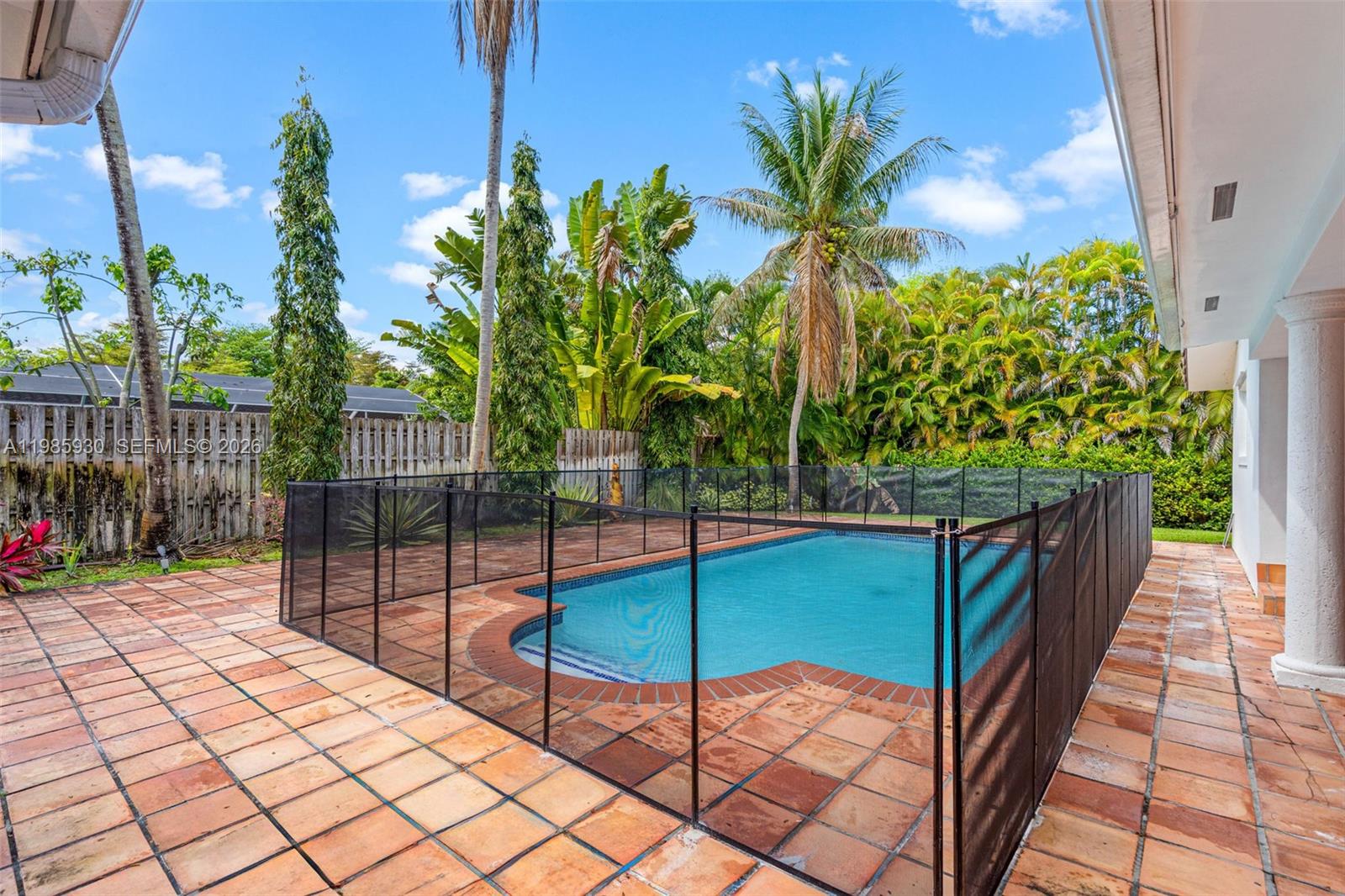 13276 Southwest 58th Court Pinecrest, FL 33156 - Photo 51 of 67 a view of a backyard