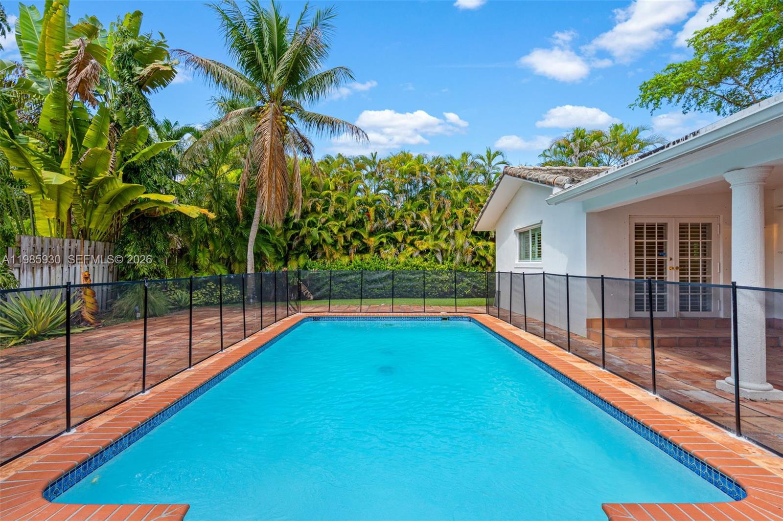 13276 Southwest 58th Court Pinecrest, FL 33156 - Photo 52 of 67 a view of swimming pool with a backyard and balcony