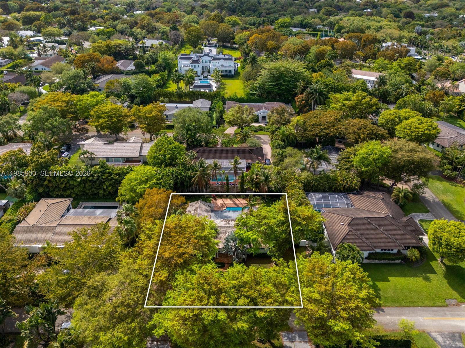 13276 Southwest 58th Court Pinecrest, FL 33156 - Photo 60 of 67 an aerial view of residential houses with outdoor space and swimming pool