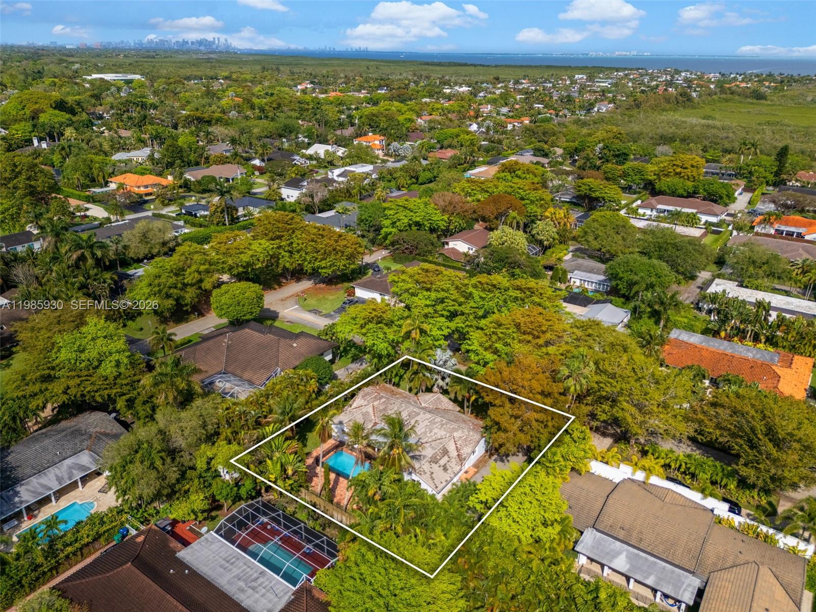 13276 Southwest 58th Court Pinecrest, FL 33156 - Photo 65 of 67 an aerial view of residential houses with outdoor space