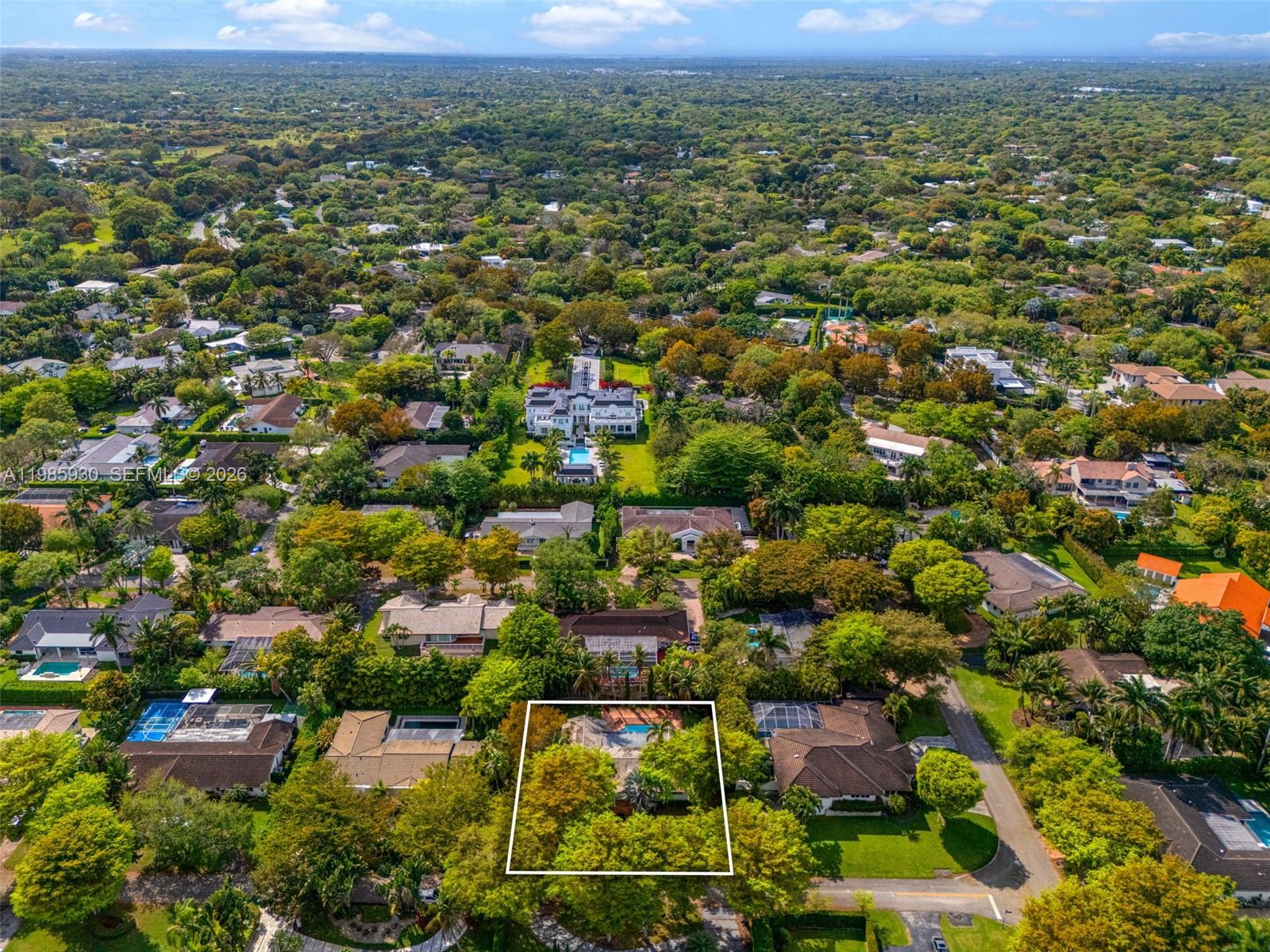13276 Southwest 58th Court Pinecrest, FL 33156 - Photo 66 of 67 an aerial view of residential houses with outdoor space and trees