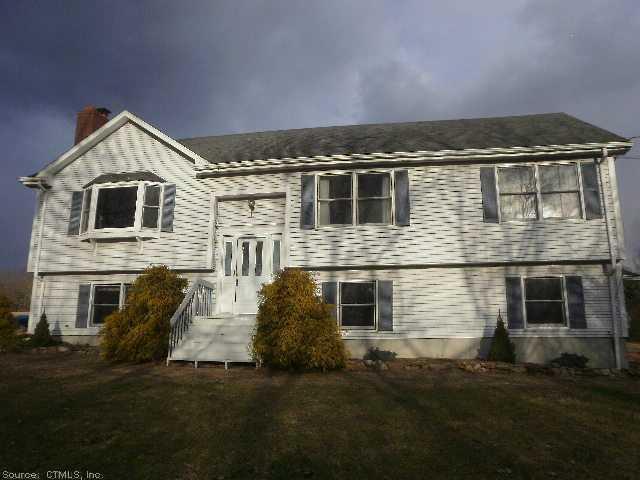 156 Cato Corner Road Colchester, CT 06415 - Photo 1 of 1 a front view of a house with a yard