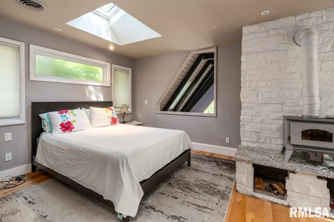 412 Wagon Wheel Road Carbondale, IL 62902 - Photo 16 of 30 a bedroom with a bed and a fireplace