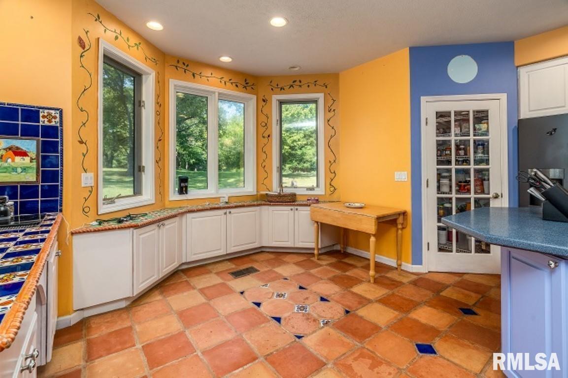 412 Wagon Wheel Road Carbondale, IL 62902 - Photo 6 of 30 a large white kitchen with a large window