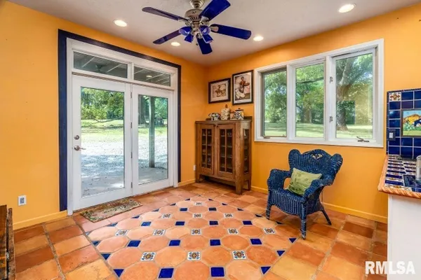 a bedroom with furniture and windows