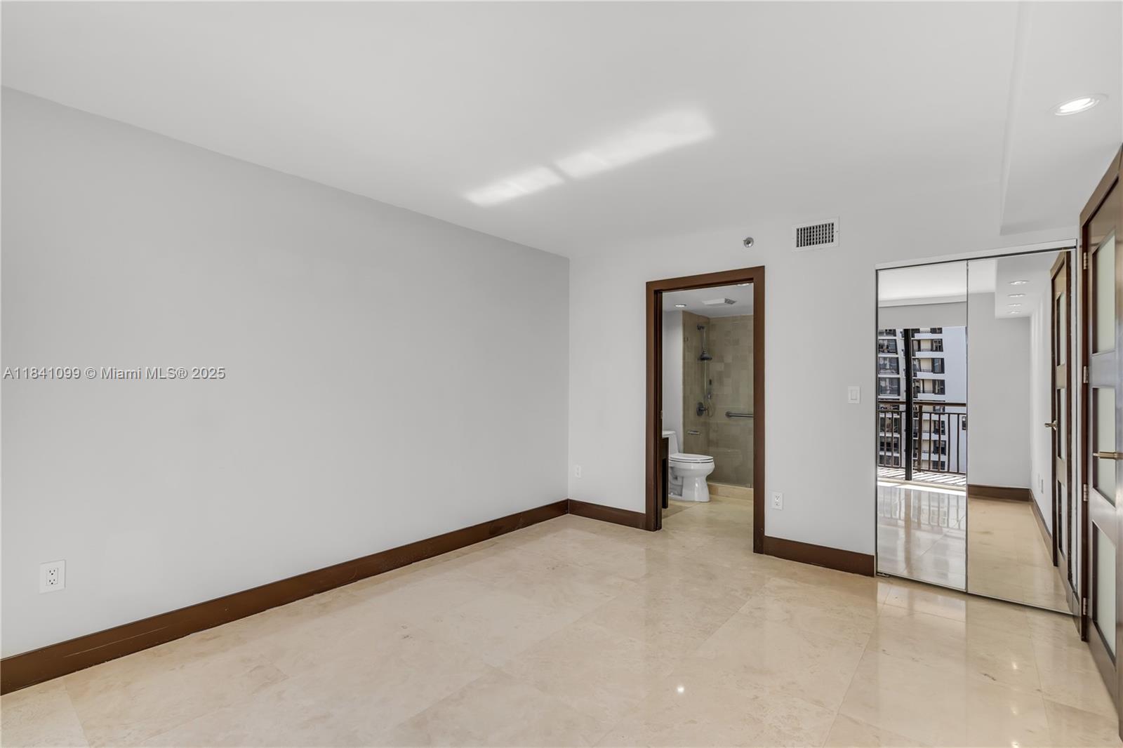 540 Brickell Key Drive, Unit 1021 Miami, FL 33131 - Photo 9 of 30 an empty room with closet