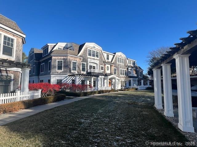103 Main Street, Unit 2202 Stonington, CT 06378 - Photo 1 of 29 a view of a big house with a yard