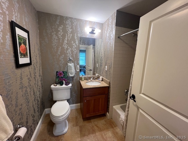 103 Main Street, Unit 2202 Stonington, CT 06378 - Photo 11 of 29 a bathroom with a toilet sink and mirror