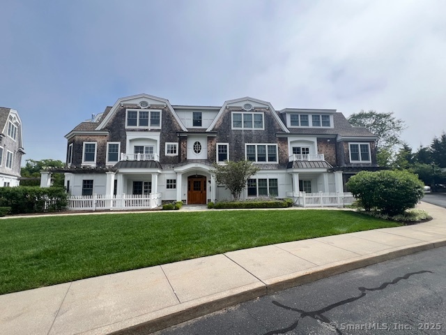 103 Main Street, Unit 2202 Stonington, CT 06378 - Photo 16 of 29 a front view of residential houses with yard and green space