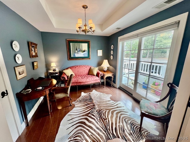 103 Main Street, Unit 2202 Stonington, CT 06378 - Photo 20 of 29 a living room with furniture and a chandelier