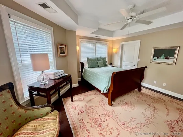 a bed room with a bed window and a couch