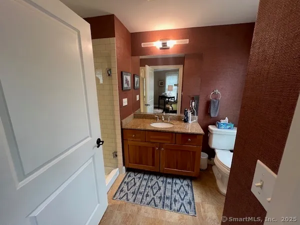 a bedroom with bed and a window