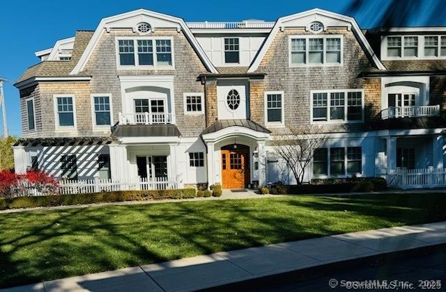103 Main Street, Unit 2202 Stonington, CT 06378 - Photo 28 of 29 a front view of a house with a yard