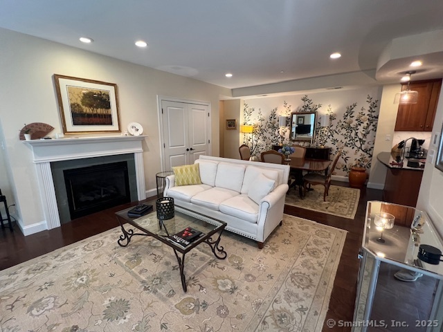 103 Main Street, Unit 2202 Stonington, CT 06378 - Photo 5 of 29 a living room with furniture and a fireplace