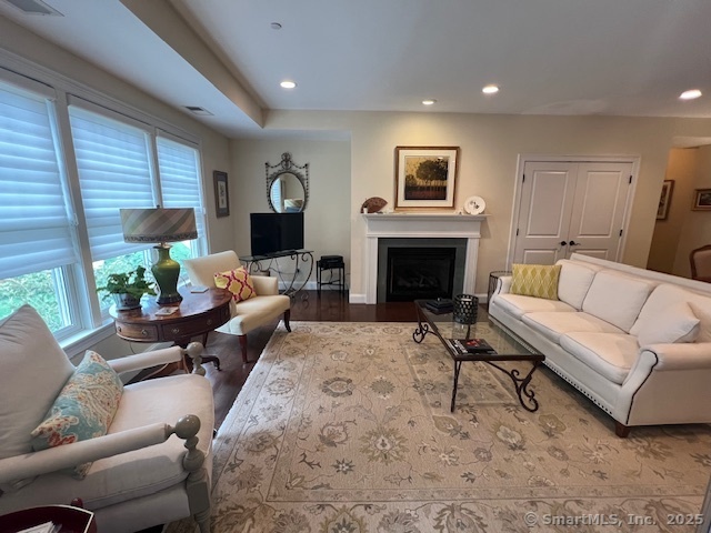 103 Main Street, Unit 2202 Stonington, CT 06378 - Photo 6 of 29 a living room with furniture flat screen tv and a fireplace